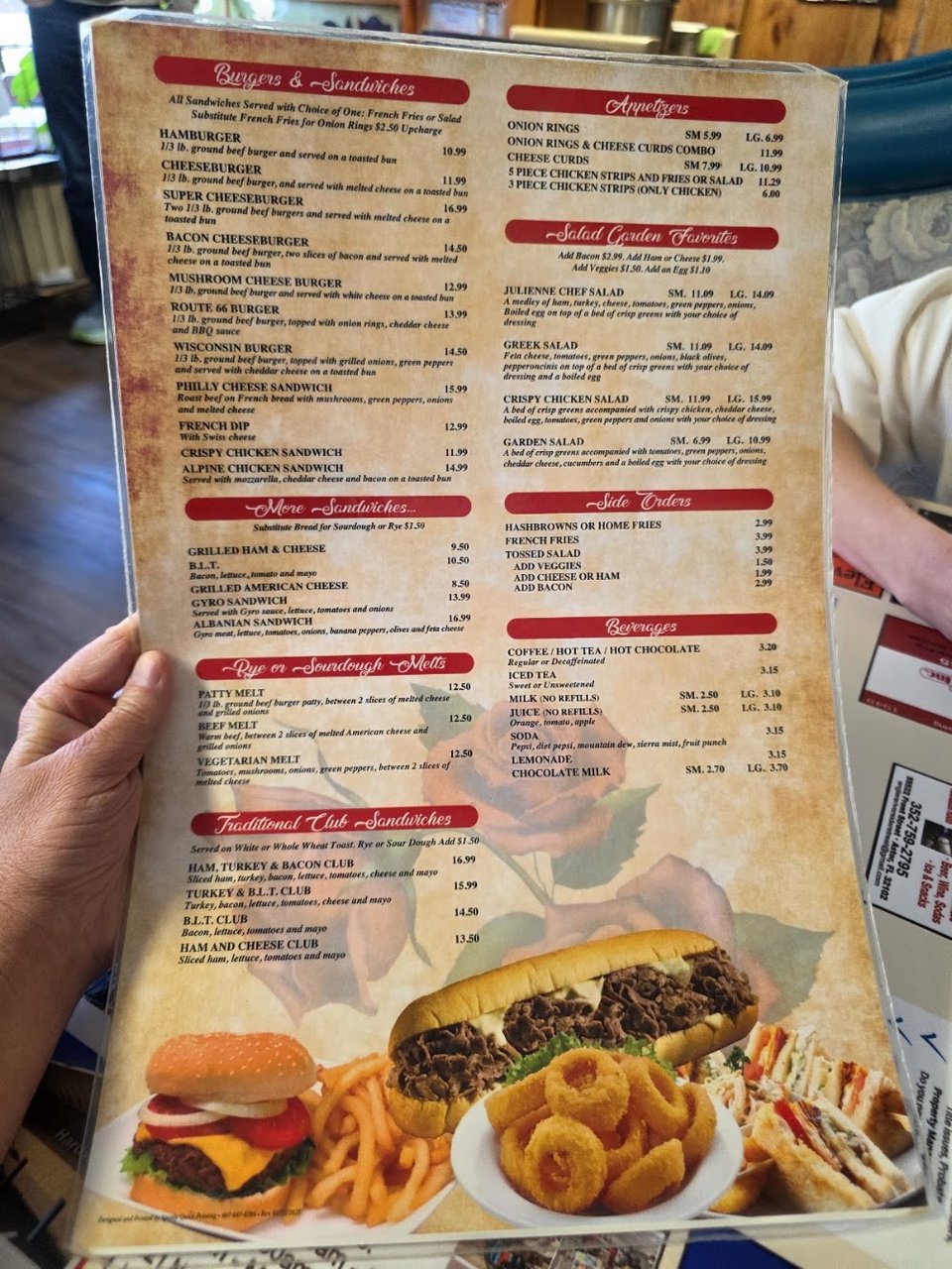 Printed menu showing salads, sides, and beverages.